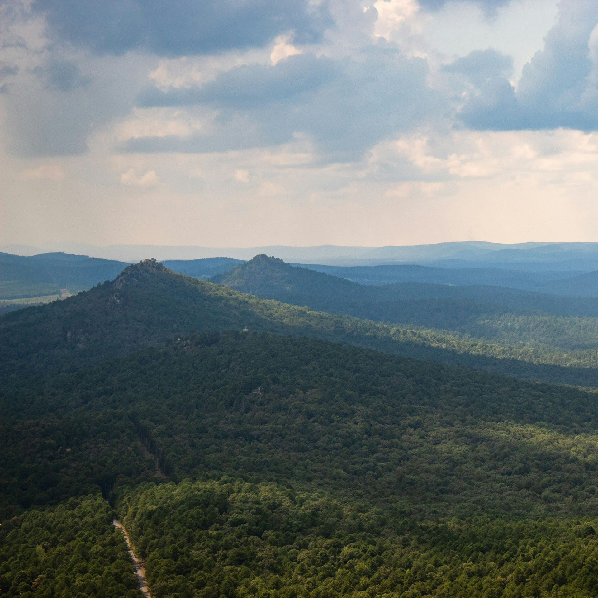 HVAC technician servicing a heating and cooling system in Benton, Arkansas